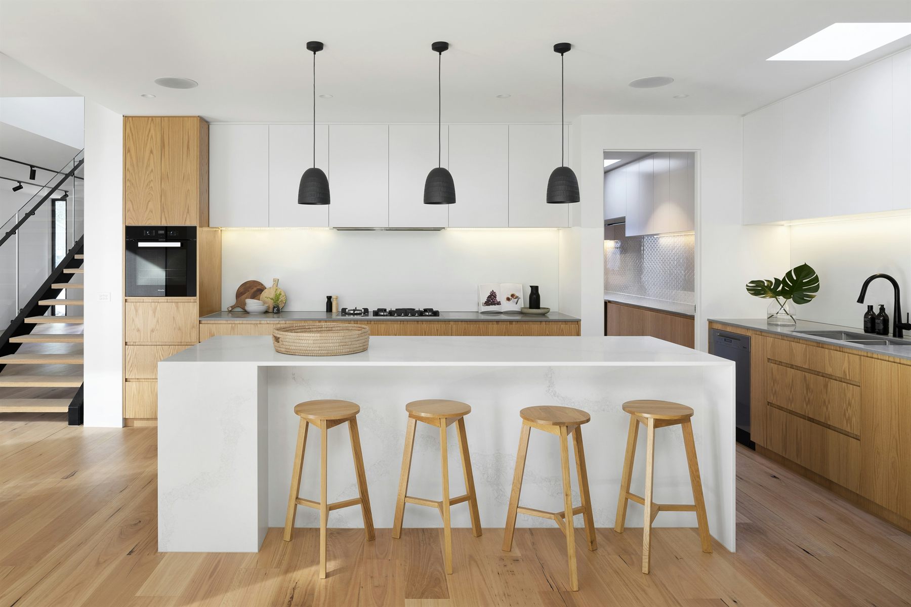 Spotless modern kitchen with gleaming stone countertops